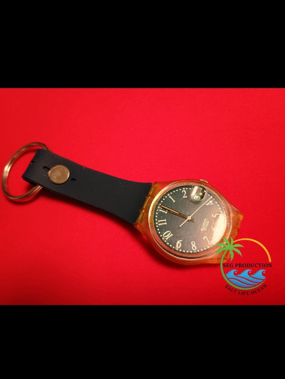 Swatch Black Dial Watch with Amber Transparent Case and Black Strap